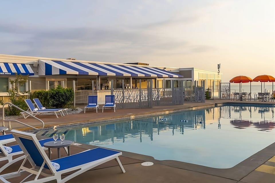 Sink into poolside calm with crisp cabanas and cocktails.