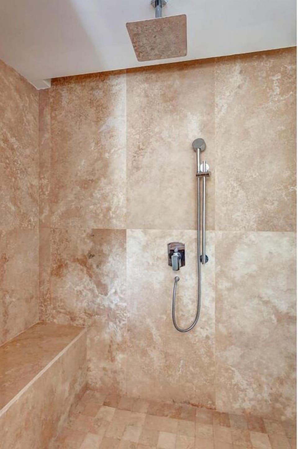 Rinse off under a rainfall shower after sun-soaked adventures.