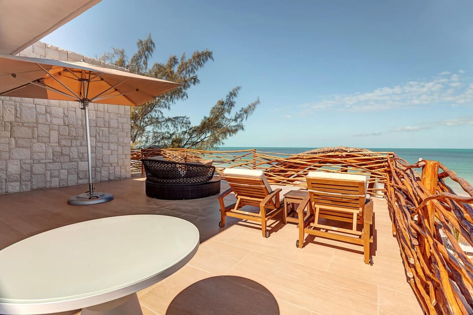 Sip morning coffee on the terrace overlooking the sea.