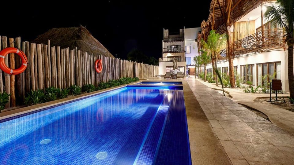 Unwind with a moonlit swim in the glowing pool.