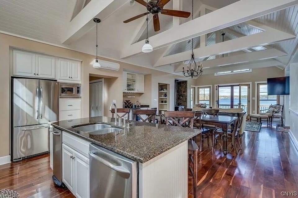 Between the kitchen and dining is a pantry, powder room and linen closet.