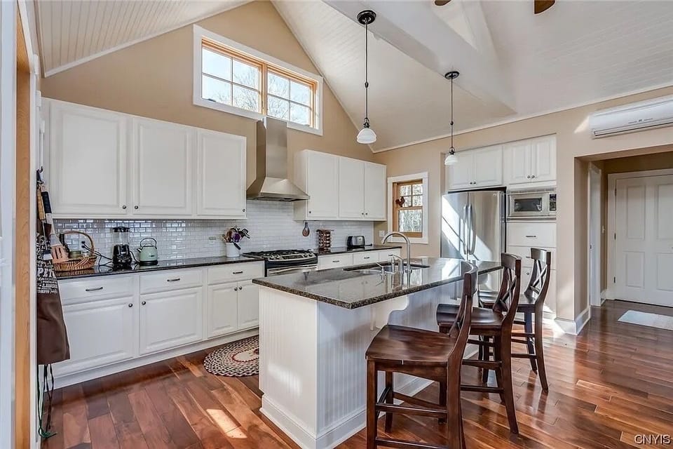 Main living area (up stairs) is an open kitchen, dining, bar, living room.