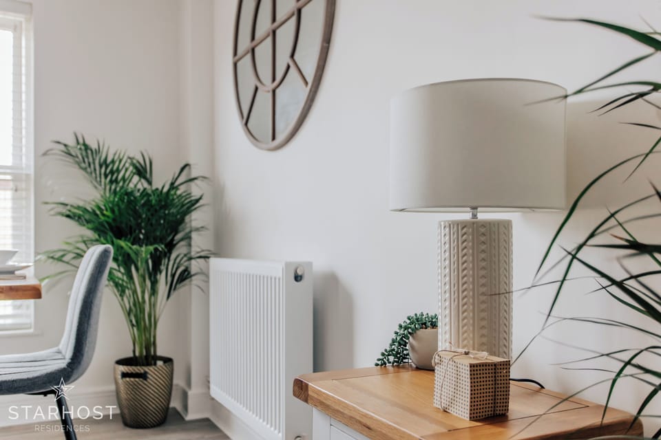 A table lamp is well-placed to offer additional light if needed