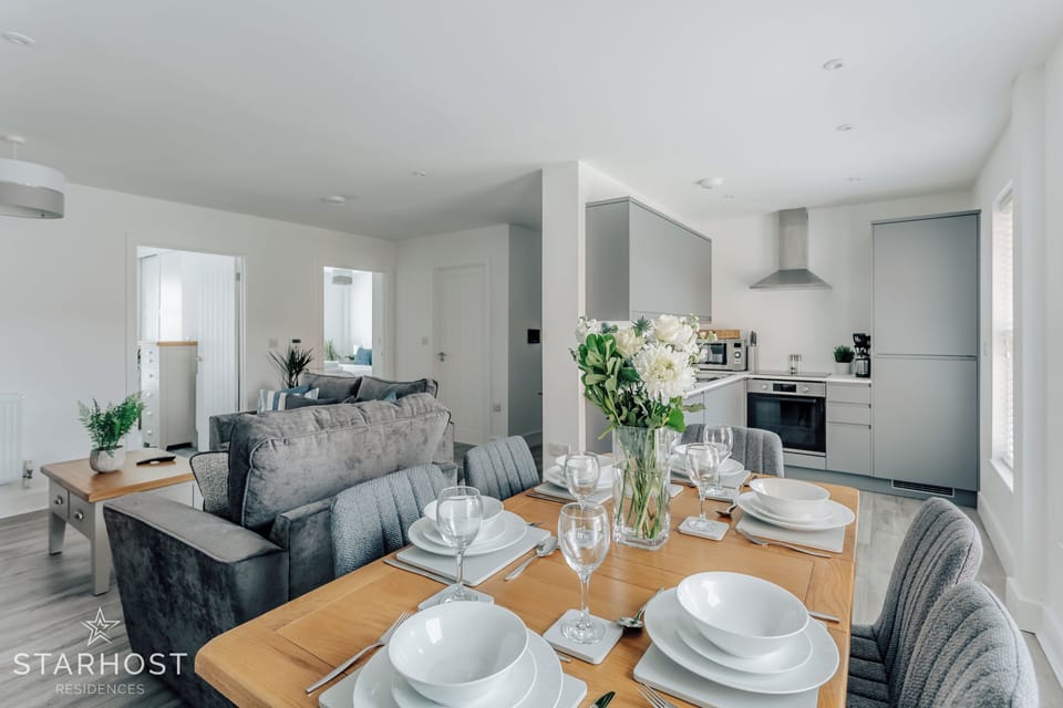 The table is close to the kitchen making it efficient for everyday use