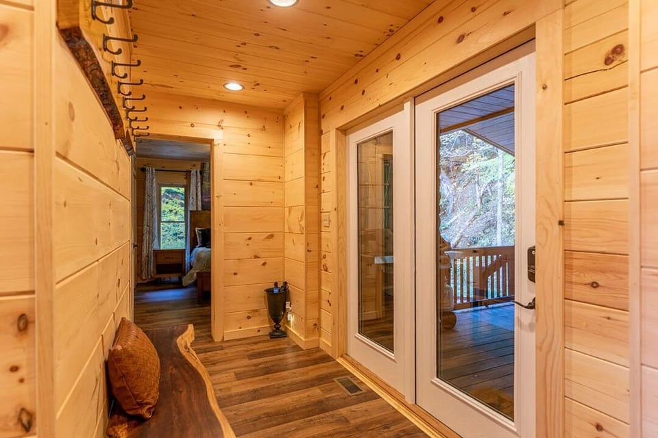 Hallway between both downstairs masters and door to back porch