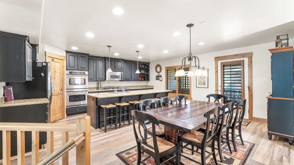 - Gather in the spacious dining area with seating for the whole group  
- Modern kitchen with granite counters and stainless steel appliances  
- Open layout makes cooking and entertaining fun and easy for everyone