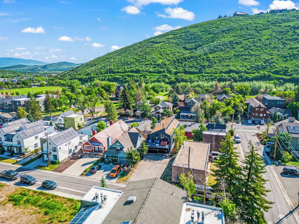 - Aerial view of Park City neighborhood and mountains  
- Home location surrounded by greenery and charm  
- Scenic access to trails, shops, and ski activities