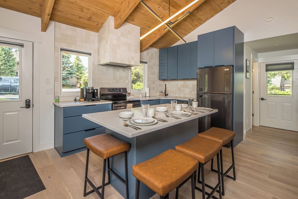The center island serves as the homes dining area and seats up to 4!