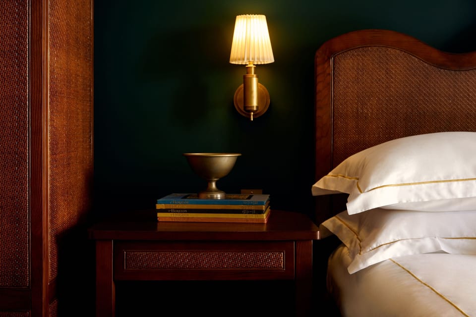 Settle in with bedside lighting and thoughtful nighttime comforts.