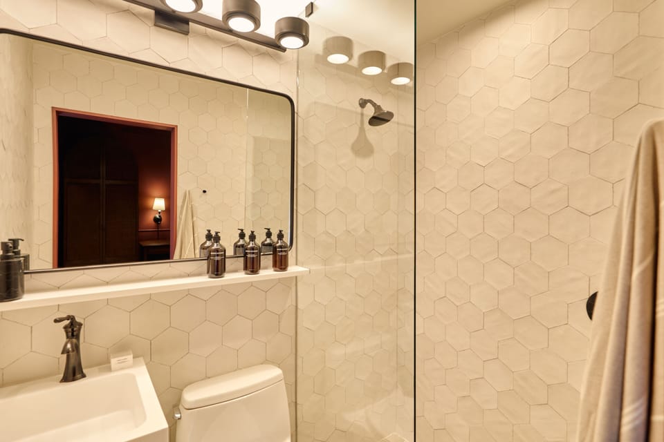 Refresh easily in a bright, spotless bathroom with modern finishes.
