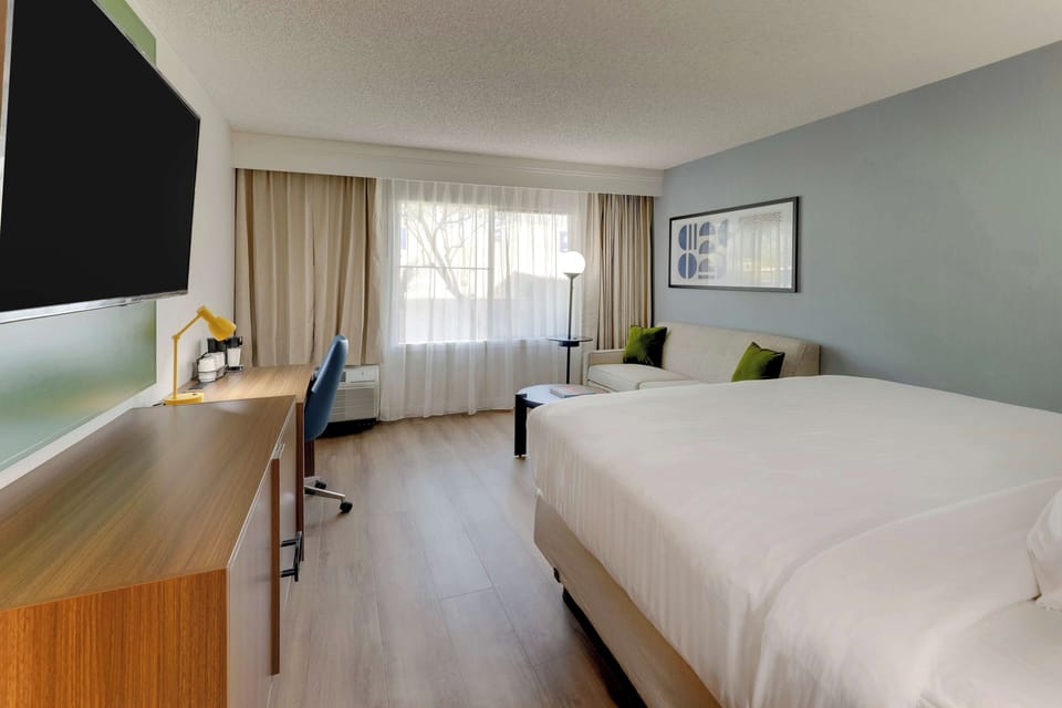Unit with 1 King bed. Exact unit will be assigned upon arrival. Views, colors, and decor may vary.