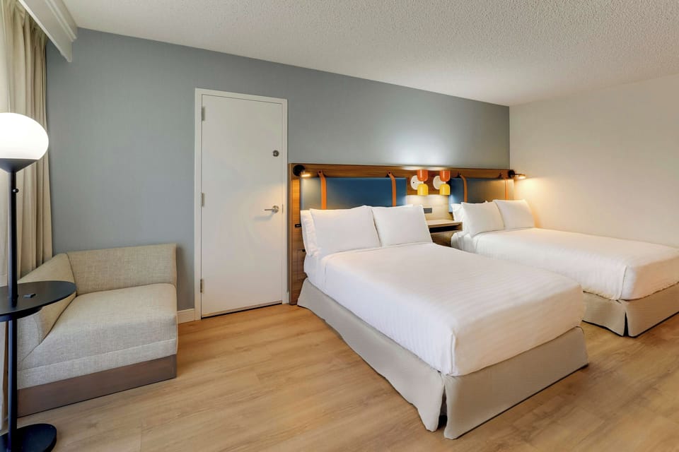 Unit with 2 Double beds. Exact unit will be assigned upon arrival. Views, colors, and decor may vary.