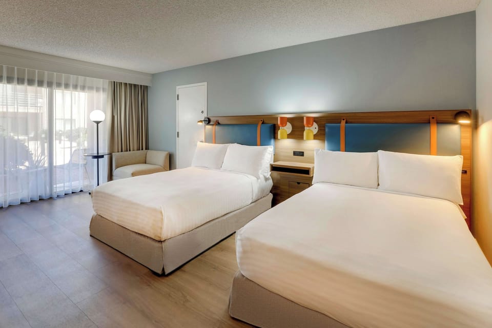 Unit with 2 Double beds. Exact unit will be assigned upon arrival. Views, colors, and decor may vary.