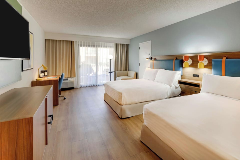 Unit with 2 Double beds. Exact unit will be assigned upon arrival. Views, colors, and decor may vary.