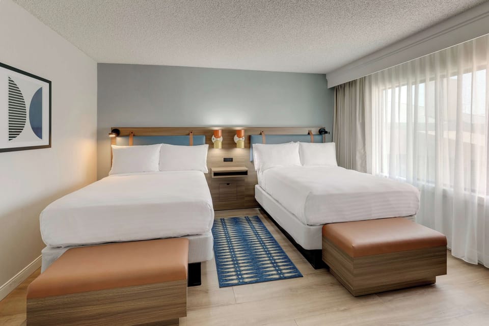 Unit with 2 Double beds. Exact unit will be assigned upon arrival. Views, colors, and decor may vary.