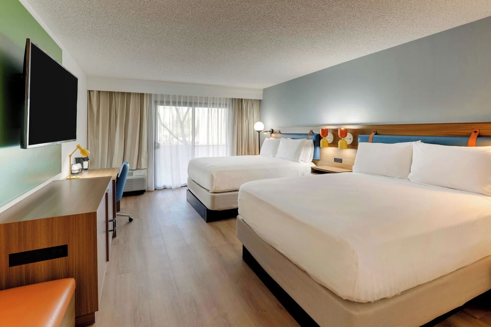 Unit with 2 Queen beds. Exact unit will be assigned upon arrival. Views, colors, and decor may vary.