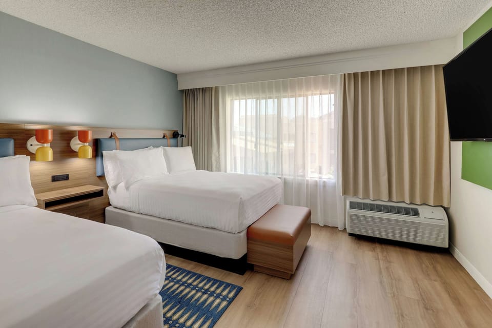 Unit with 2 Double beds. Exact unit will be assigned upon arrival. Views, colors, and decor may vary.