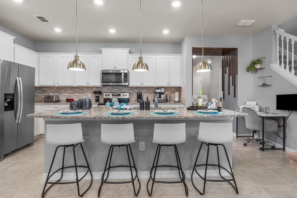 Enjoy convenient breakfast bar with 4 bar stools.