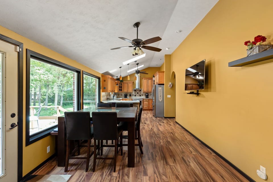 Dining + kitchen area with smart TV