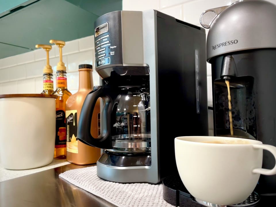 Kitchen - includes cooking utensils, pots, pans, etc. Oh did I mention there is a Nespresso maker with pods provided? And a coffee bar?! 