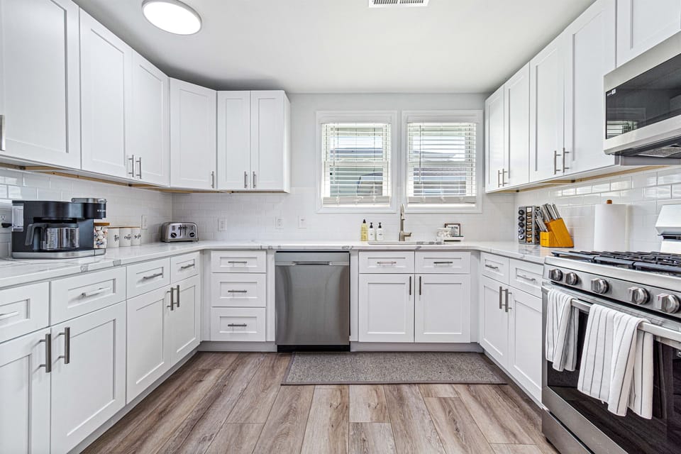 Cook with ease and style in our kitchen adorned with ample cabinetry, spacious granite countertops, and state-of-the-art appliances.