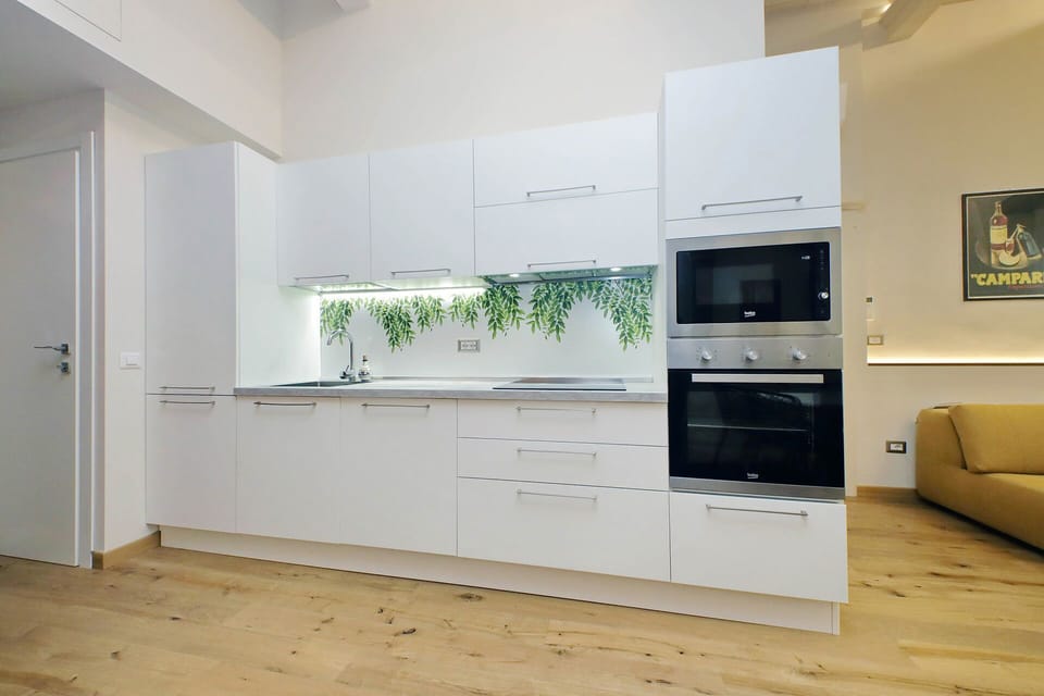 Fully equipped modern kitchen located just off living area.