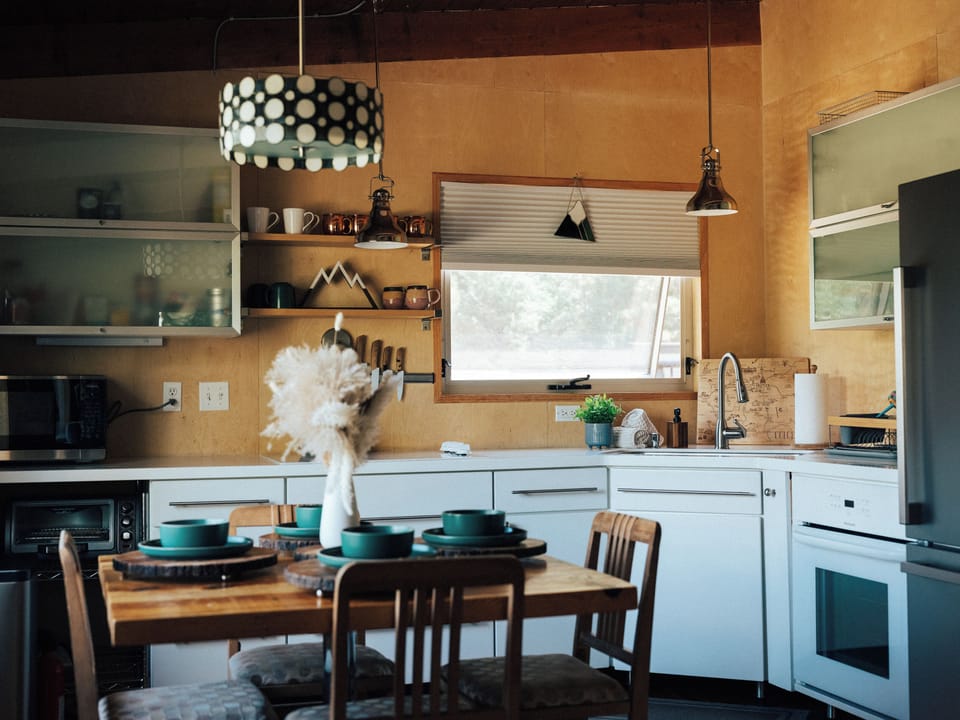 A fully equipped kitchen designed for easy morning coffees and shared meals.