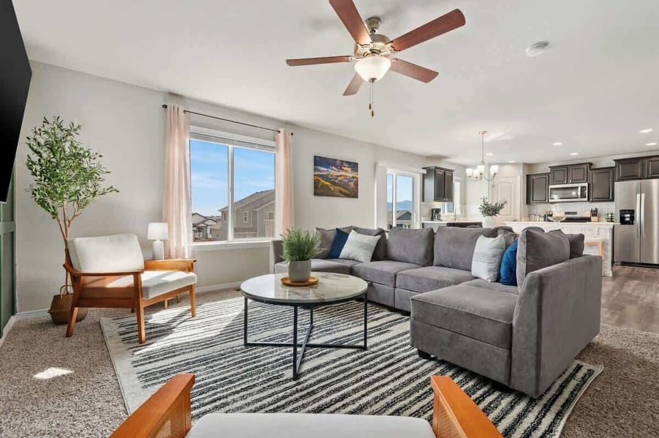 Cozy sectional sofa, 65" TV, base green accent wall