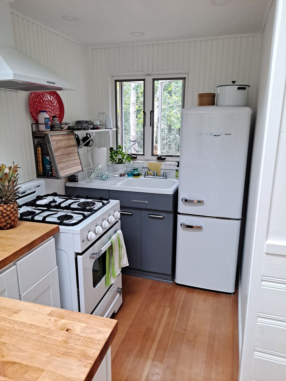 Kitchenette with new gas stove and refrigerator. Includes many cooking amenities