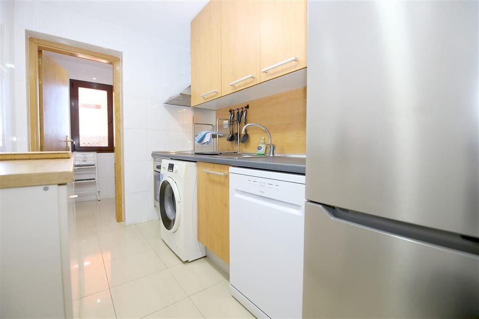 Kitchen is fully equipped with all the appliances and utility room to the rear