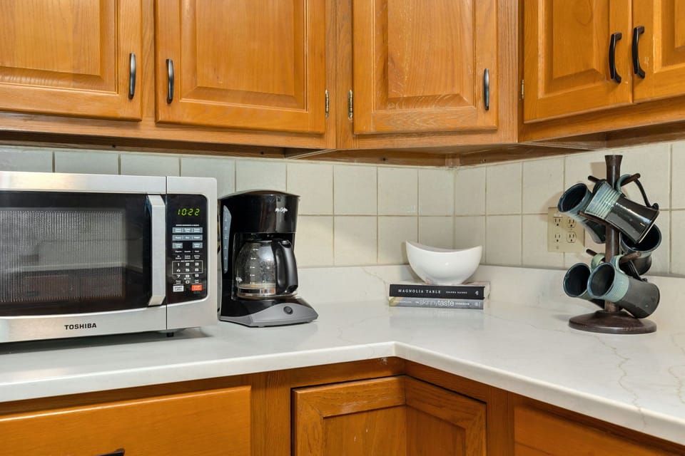 Kitchen has been updated with new stainless appliances & quartz countertop.