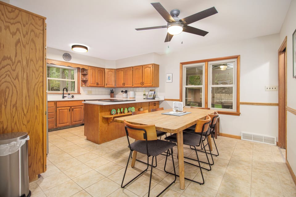 Large eat-in kitchen overlooks screen porch & backyard. Table expands to seat 8 