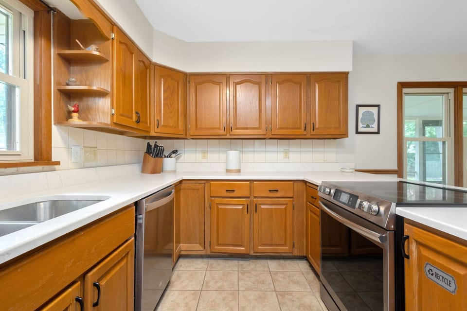 Kitchen has been updated with new stainless appliances & quartz countertop.