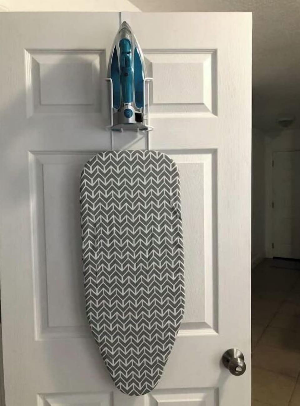 iron and mini ironing board in laundry room