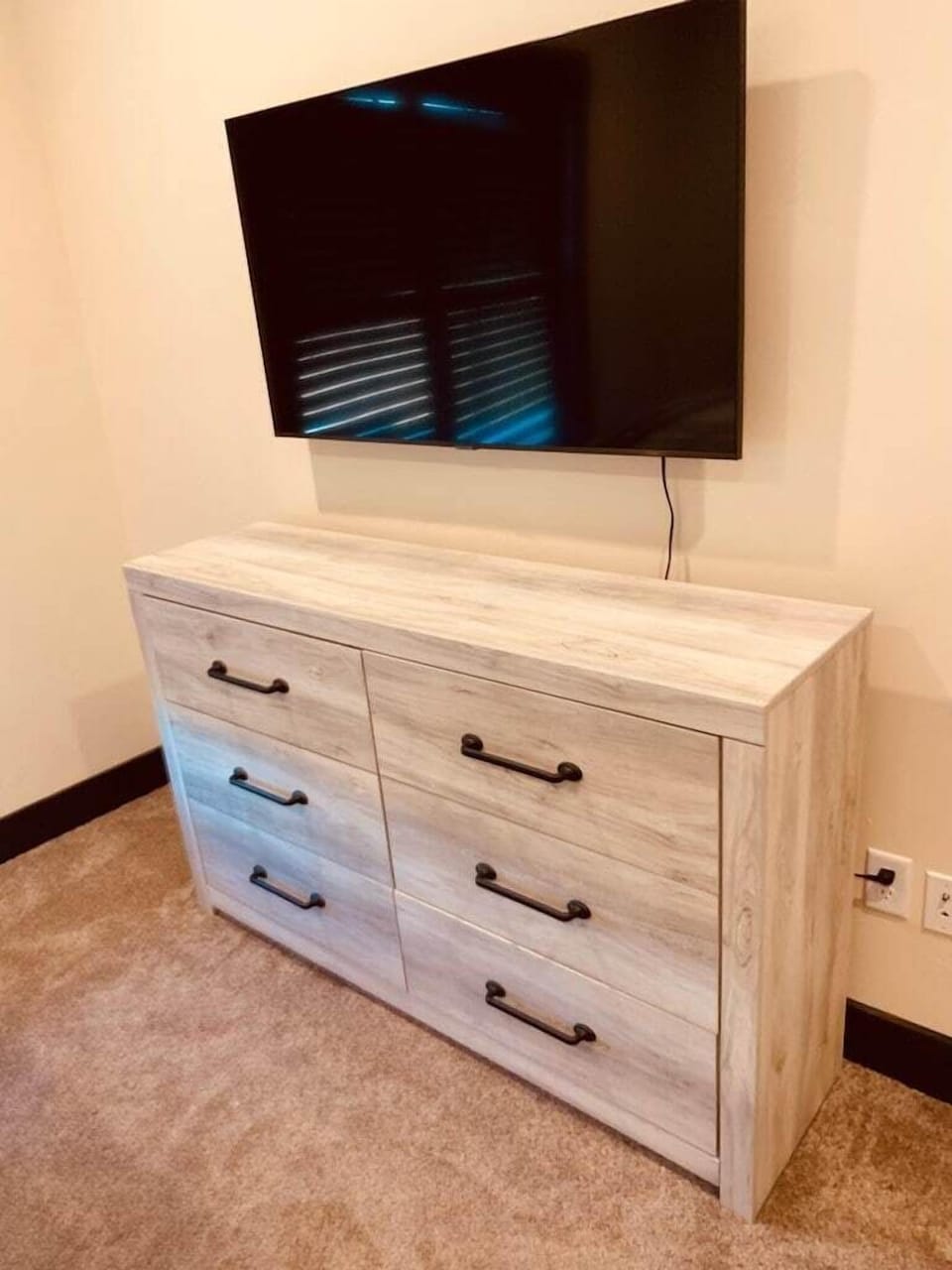 Dresser and TV in second bedroom.