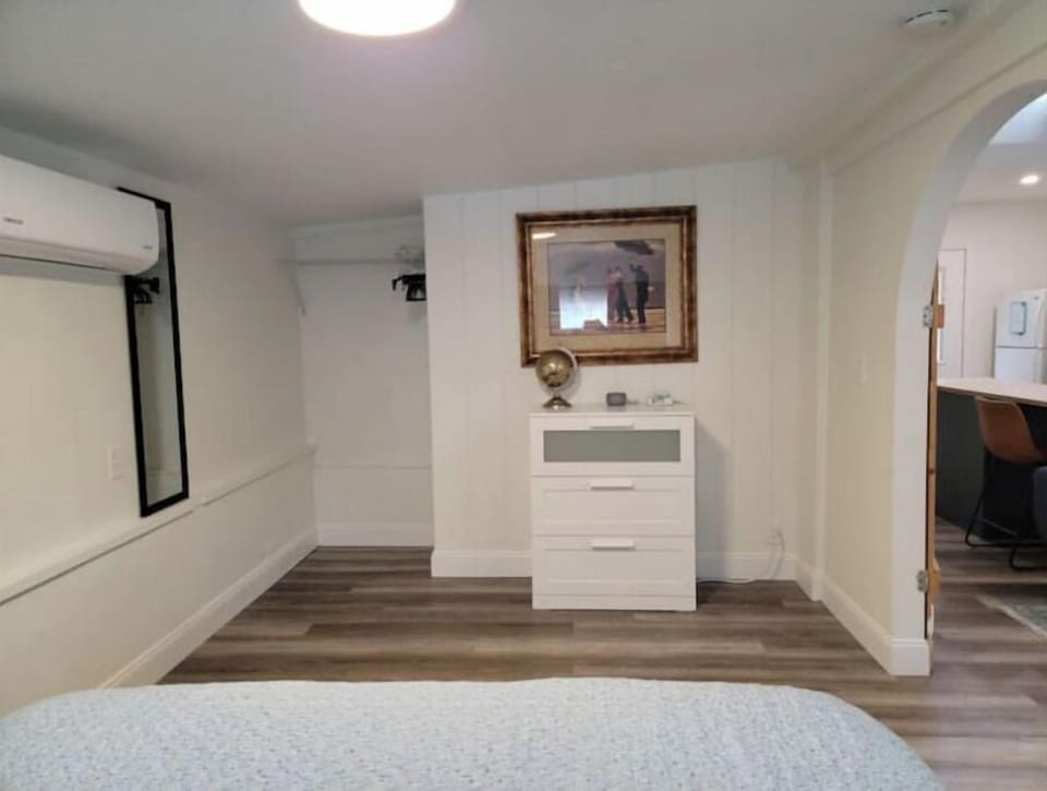 Bedroom with Dresser and Hanging Space