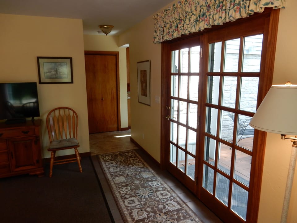 Main entrance on the deck to the dining room, extra living room.