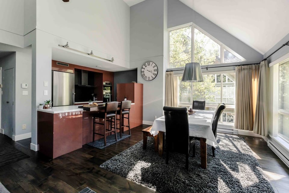 Large family style dining room space with eat-up bar at the kitchen 