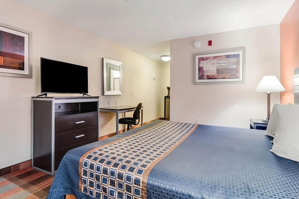 Recharge in a calm, simple bedroom designed for restful sleep.