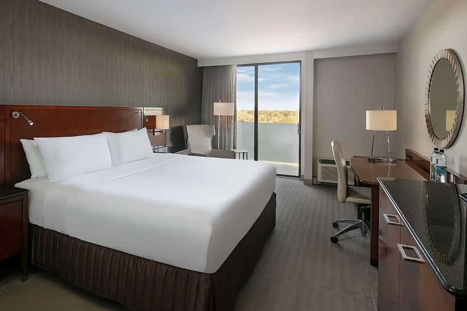 Unwind in a spacious king room with soothing balcony view.