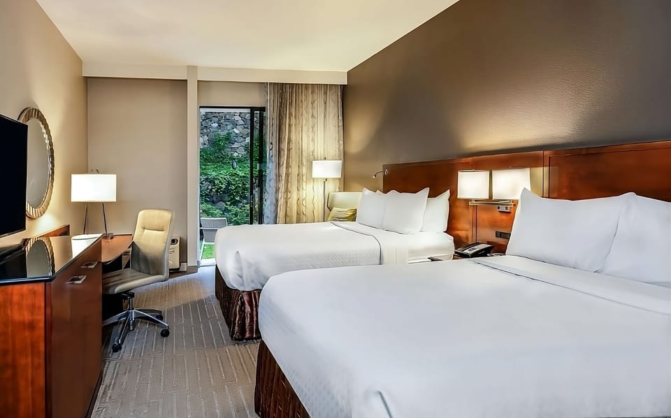 Settle into two plush queen beds after a busy day.