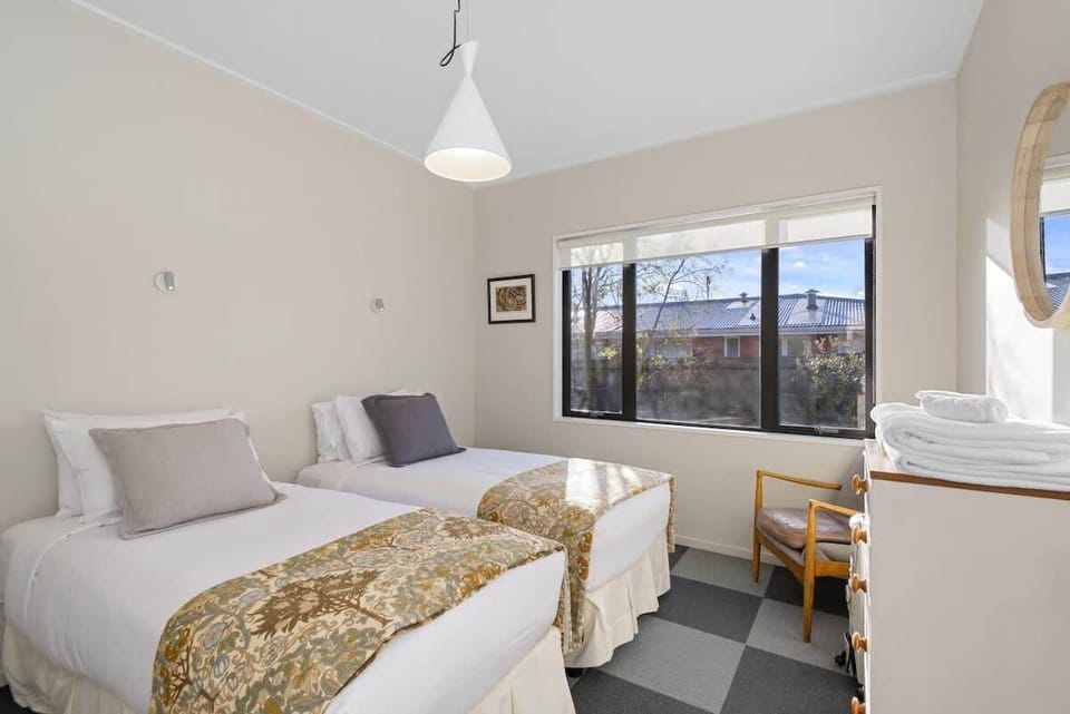 There are two single beds in this cosy second bedroom.