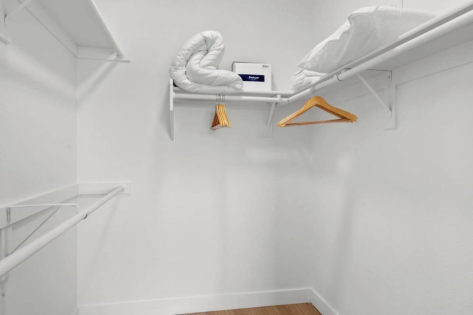 Huge walk in closet with extra futon linens