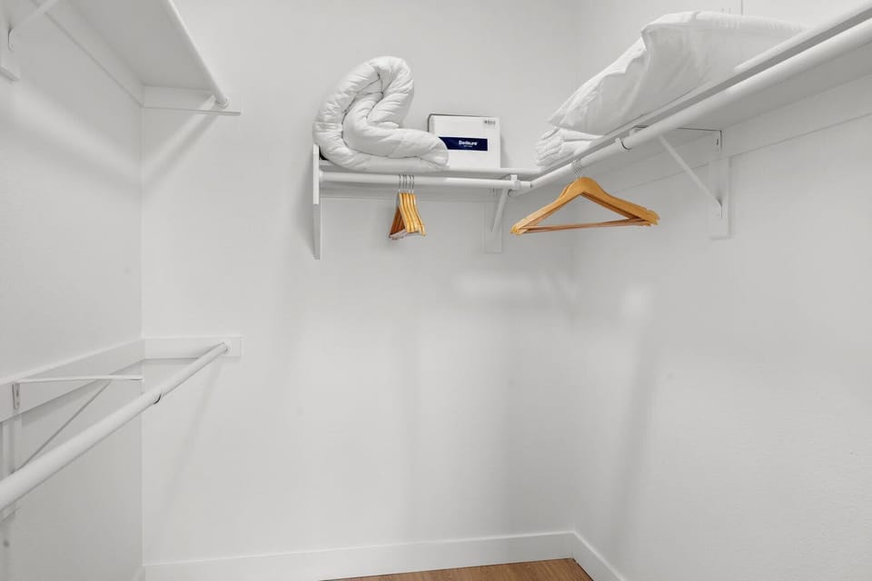 Huge walk in closet with extra futon linens