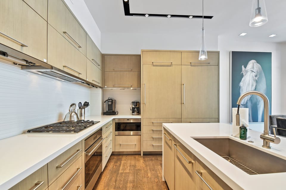 Sleek and modern finishes in the fully stocked kitchen.