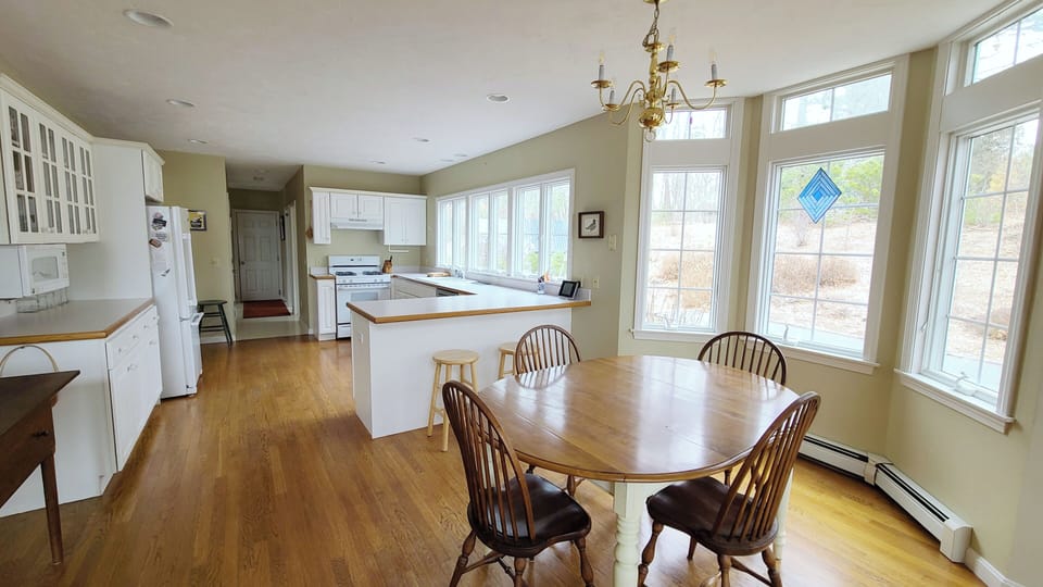 Dining area with kitchen beyond