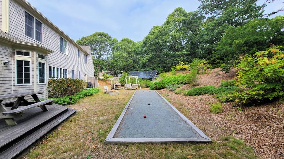 Backyard with firepit and bocce court