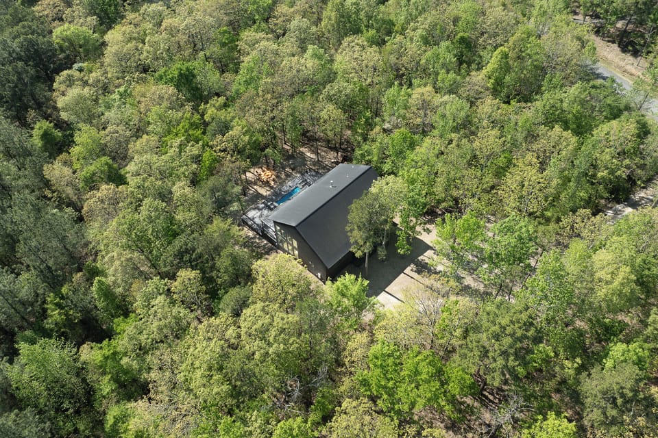 Exterior: Retreat to this modern cabin, embraced by nature's beauty and tranquil surroundings!