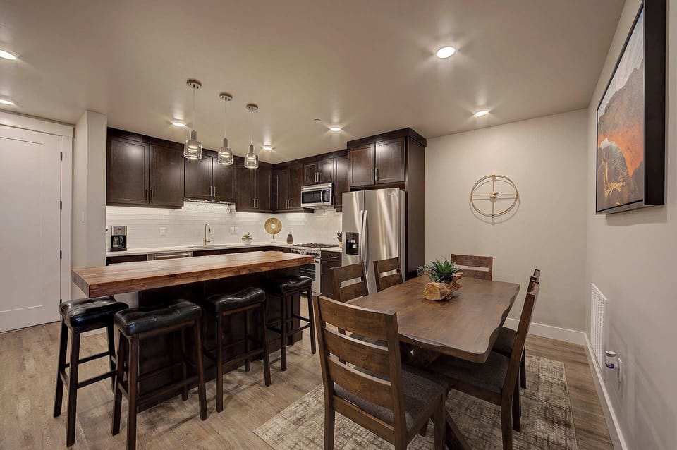 Plenty of seating is available at mealtimes at the dining table and kitchen island.