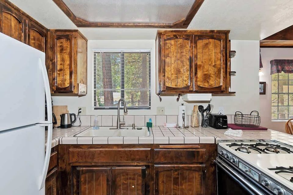 Well equipped kitchen with counter space and natural light. 